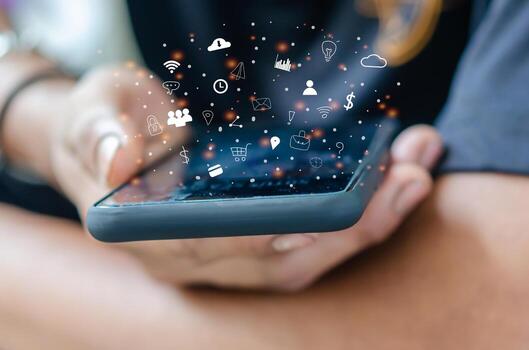 hand-holding-smartphone-with-icons-free-photo